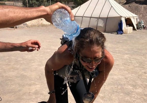 Someone pouring water over Rochelle after she finished her race